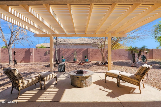 view of patio with a pergola and a fire pit