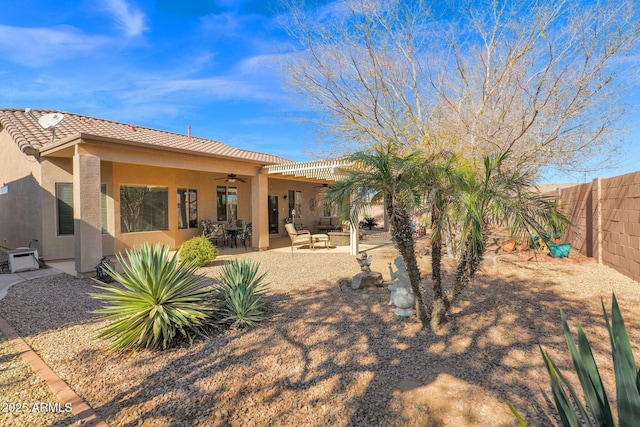 back of house featuring ceiling fan and a patio area