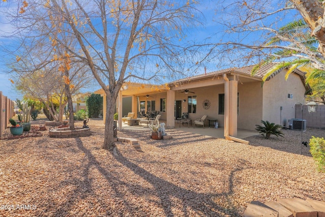 back of property featuring ceiling fan, a patio area, and central AC