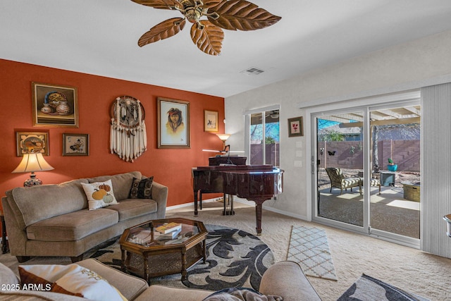 living room with light carpet and ceiling fan