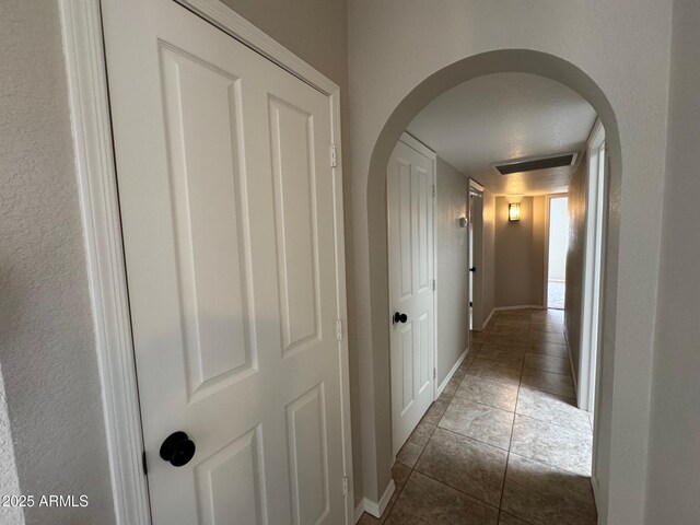 2077 N Lake Shore Dr, Casa Grande, AZ 85122 - corridor with arched walkways, baseboards, visible vents, and tile patterned floors