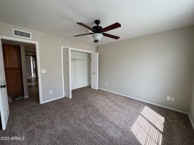 2077 N Lake Shore Dr, Casa Grande, AZ 85122 - unfurnished bedroom featuring a closet, carpet flooring, visible vents, and baseboards