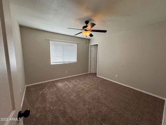 2077 N Lake Shore Dr, Casa Grande, AZ 85122 - carpeted spare room featuring baseboards, a textured ceiling, and ceiling fan