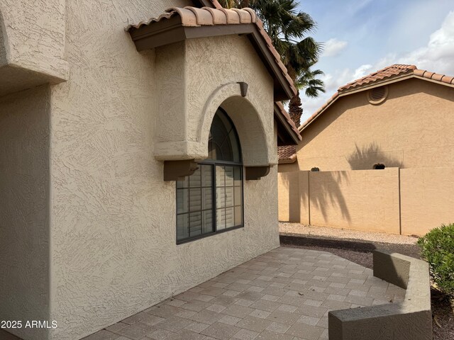 2077 N Lake Shore Dr, Casa Grande, AZ 85122 - exterior space with fence, a tile roof, stucco siding, and a patio