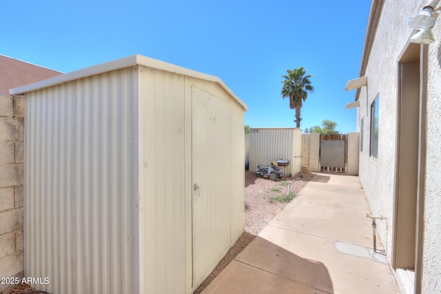 2077 N Lake Shore Dr, Casa Grande, AZ 85122 - view of shed with a gate and fence