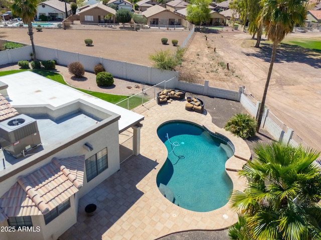2077 N Lake Shore Dr, Casa Grande, AZ 85122 - view of swimming pool featuring a patio, a fenced backyard, and a residential view