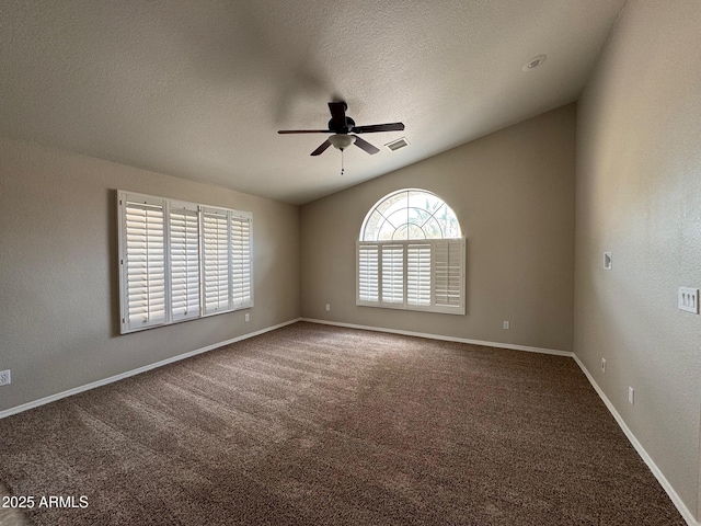 2077 N Lake Shore Dr, Casa Grande, AZ 85122 - carpeted spare room featuring a ceiling fan, a wealth of natural light, lofted ceiling, and visible vents