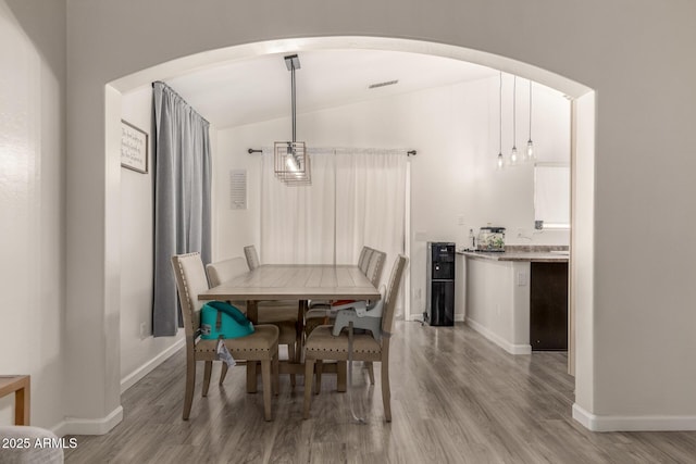 dining area featuring light wood-type flooring