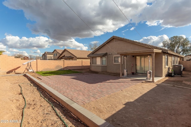 back of house featuring a patio