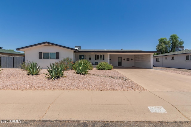 701 N 55th Pl, Mesa, AZ 85205 - ranch-style house featuring an attached carport and concrete driveway