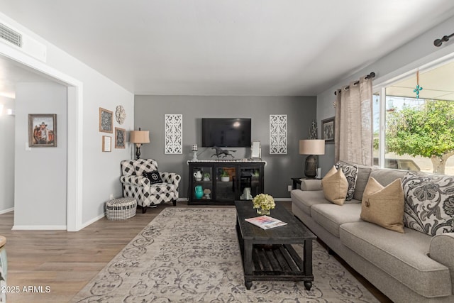 701 N 55th Pl, Mesa, AZ 85205 - living room featuring wood finished floors and baseboards