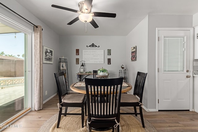 701 N 55th Pl, Mesa, AZ 85205 - dining area with light wood-style flooring, ceiling fan, and baseboards