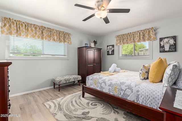701 N 55th Pl, Mesa, AZ 85205 - bedroom featuring light wood-style flooring and a ceiling fan