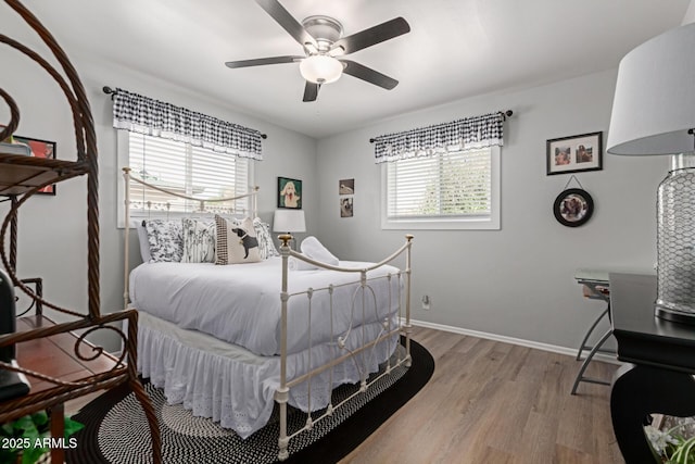 701 N 55th Pl, Mesa, AZ 85205 - bedroom with wood finished floors, baseboards, and ceiling fan