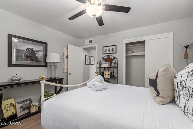 701 N 55th Pl, Mesa, AZ 85205 - bedroom with a closet, wood finished floors, and ceiling fan