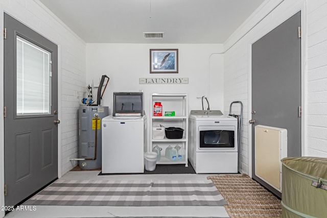 701 N 55th Pl, Mesa, AZ 85205 - laundry area with water heater and washing machine and dryer