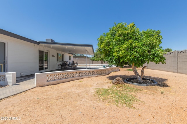 701 N 55th Pl, Mesa, AZ 85205 - fenced backyard featuring a patio area