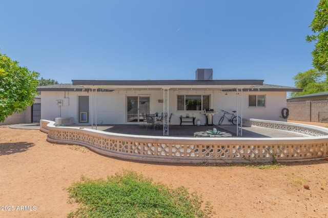 701 N 55th Pl, Mesa, AZ 85205 - back of property featuring a patio area and a chimney