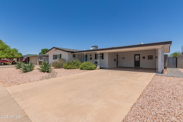 701 N 55th Pl, Mesa, AZ 85205 - ranch-style home featuring an attached carport and driveway
