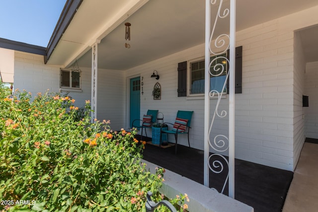 701 N 55th Pl, Mesa, AZ 85205 - property entrance with a porch and brick siding