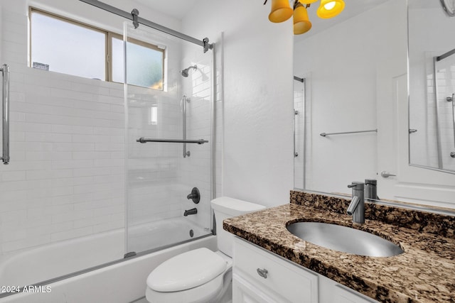 full bathroom with vanity, toilet, and bath / shower combo with glass door