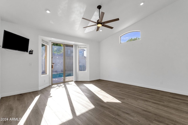 unfurnished room featuring high vaulted ceiling, ceiling fan, and dark wood-type flooring