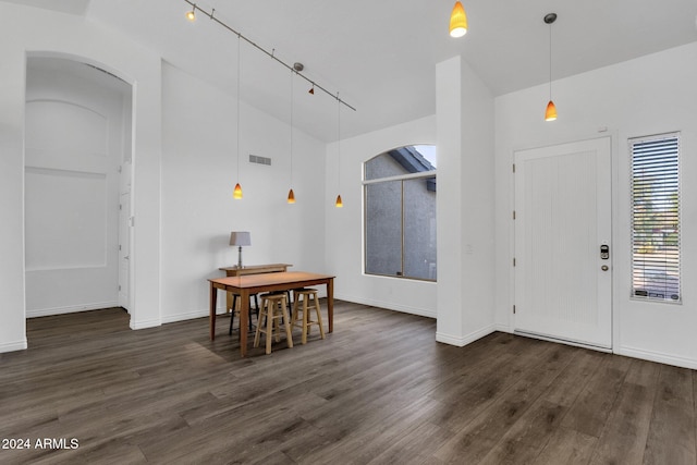 dining space with dark hardwood / wood-style floors