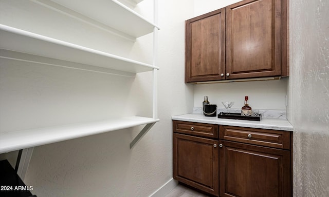 bar with dark brown cabinets