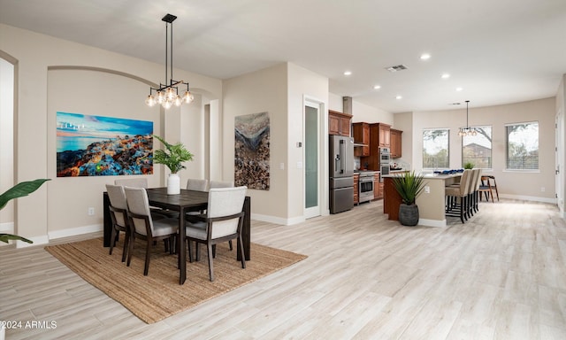 dining room with light wood-type flooring