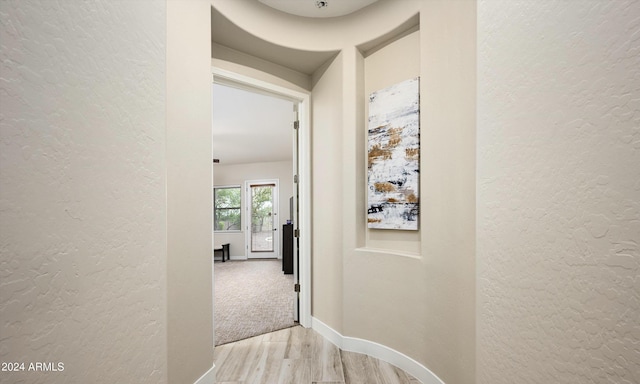 corridor featuring light hardwood / wood-style flooring