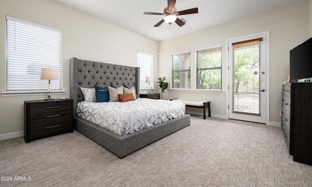 carpeted bedroom featuring access to exterior and ceiling fan