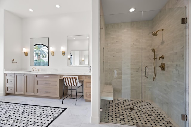 full bath featuring double vanity, recessed lighting, a sink, a shower stall, and marble finish floor