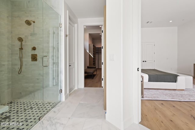 full bath featuring a shower stall, visible vents, and marble finish floor