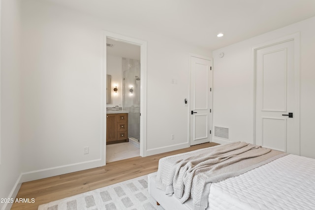 bedroom featuring recessed lighting, light wood-style floors, visible vents, and baseboards