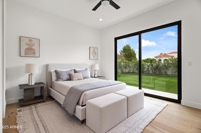 bedroom featuring access to outside, recessed lighting, baseboards, and light wood finished floors