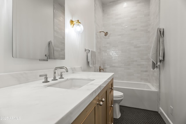 bathroom with vanity, tile patterned floors, toilet, and shower / washtub combination