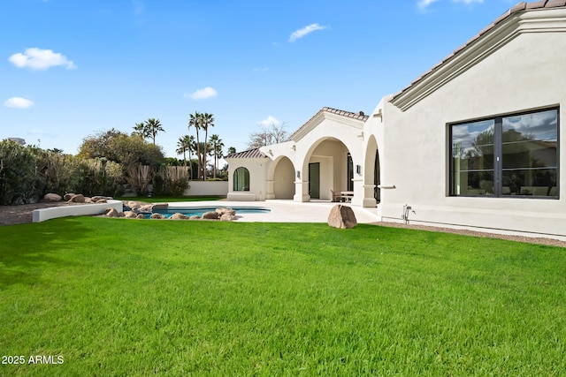 view of yard featuring an outdoor pool and a patio