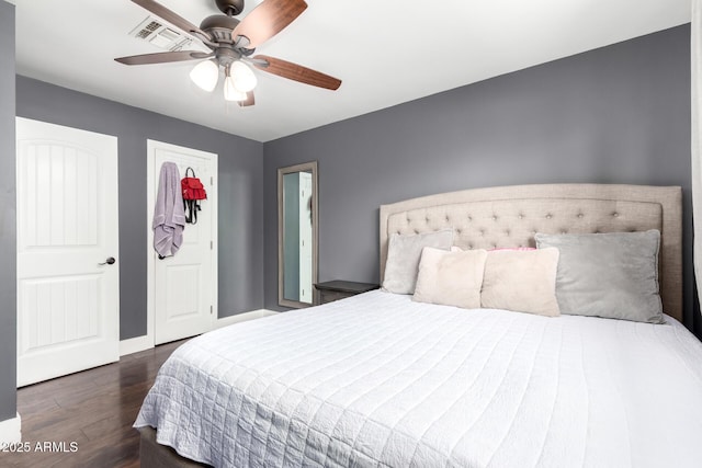 bedroom featuring dark hardwood / wood-style floors and ceiling fan