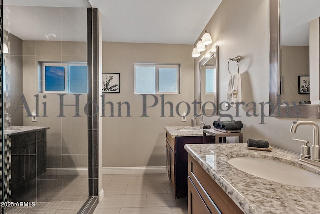 bathroom with vanity, an enclosed shower, and tile patterned flooring