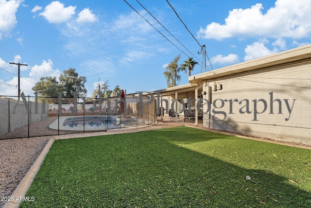 exterior space with a fenced in pool and a patio area