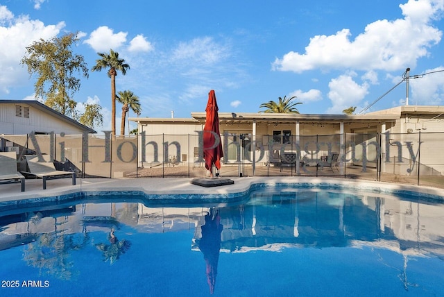 view of swimming pool with a patio area