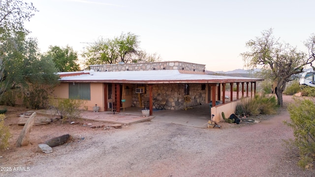 2315 N US Highway 93, Wickenburg, AZ 85390 - view of front facade with stone siding and an AC wall unit