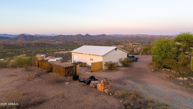 2315 N US Highway 93, Wickenburg, AZ 85390 - exterior space with a mountain view, a metal roof, driveway, and a pole building