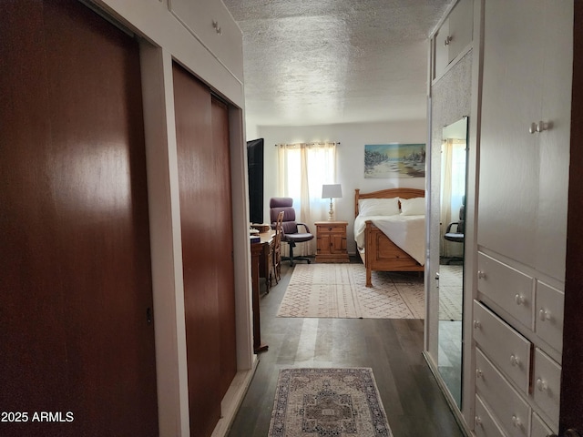 2315 N US Highway 93, Wickenburg, AZ 85390 - bedroom with wood finished floors and a textured ceiling