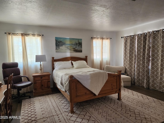 2315 N US Highway 93, Wickenburg, AZ 85390 - bedroom with light wood-type flooring and a textured ceiling