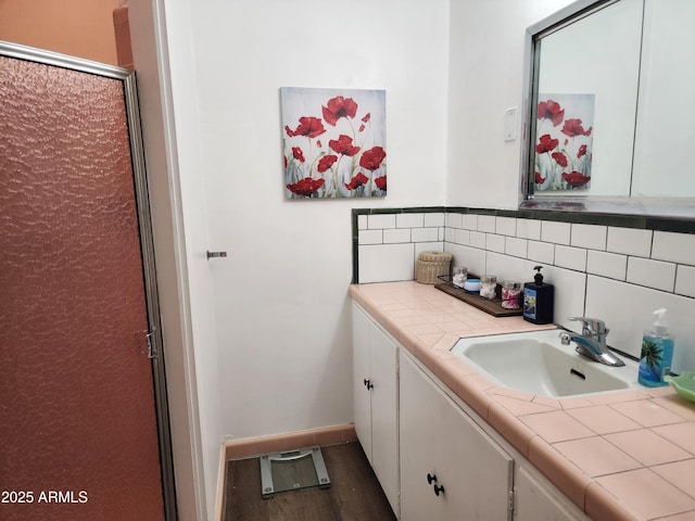 2315 N US Highway 93, Wickenburg, AZ 85390 - bathroom featuring vanity, tasteful backsplash, and wood finished floors