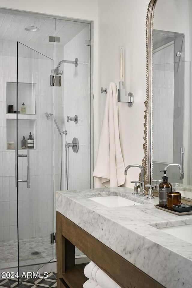 bathroom with vanity and an enclosed shower