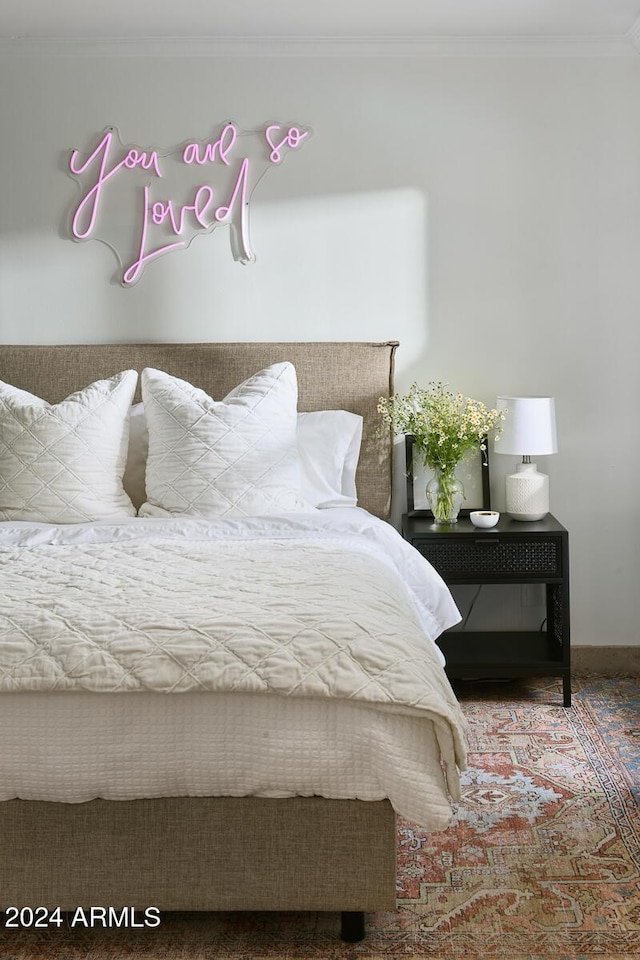 bedroom with crown molding