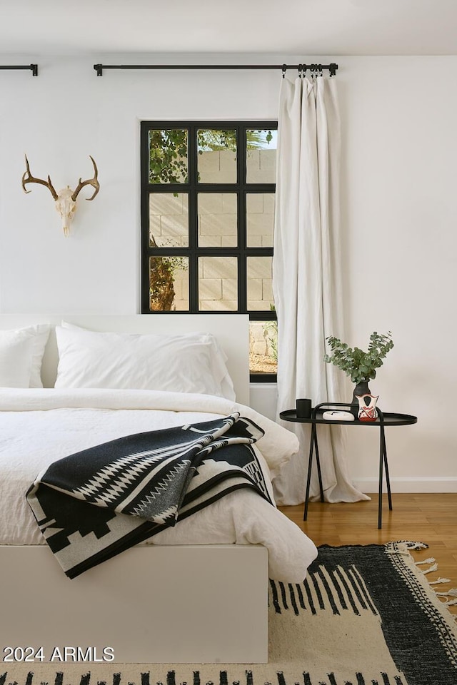 bedroom featuring hardwood / wood-style flooring