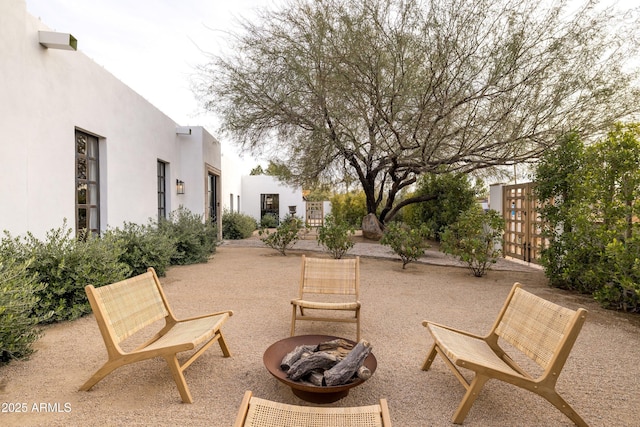 view of patio / terrace featuring an outdoor fire pit